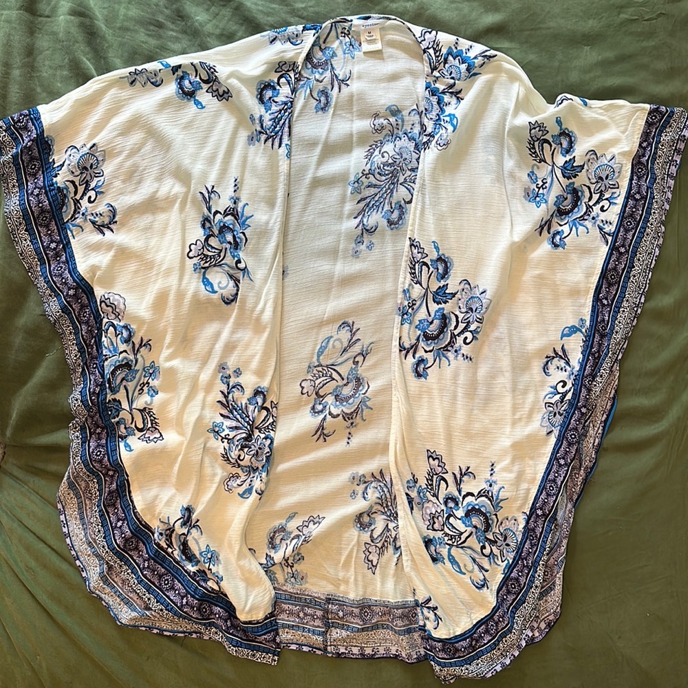 Cream duster with purple/blue floral accents. Fantastic to use as a beach cover!